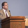 Man speaking at podium