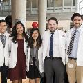 Five students pose for a photo